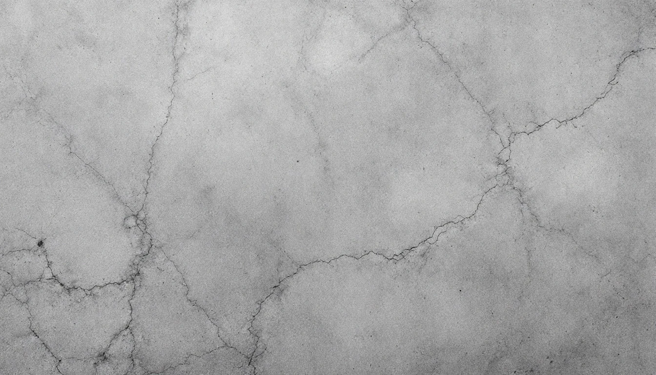 Smooth gray cement surface with fine trowel marks in soft light